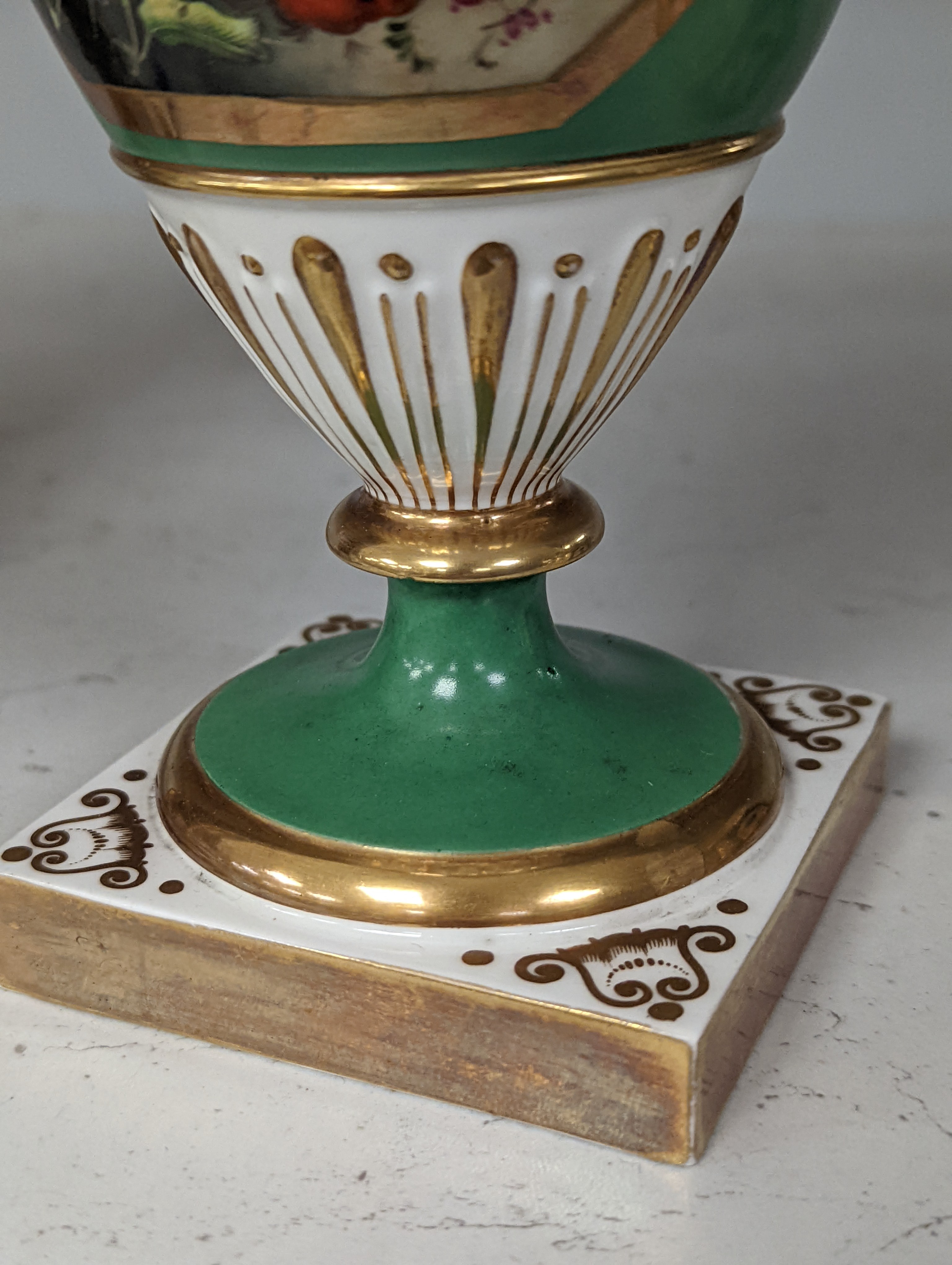 An English porcelain two handled vase painted with flowers in a panel on a green ground, probably Grainger Worcester, c.1830, height 24cm